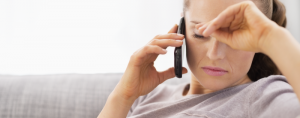 Woman appears sad using a phone