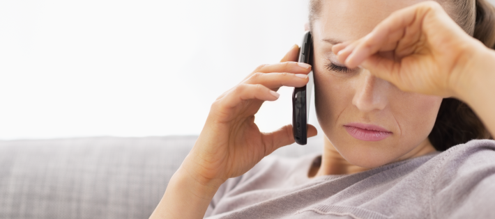 Woman appears sad using a phone